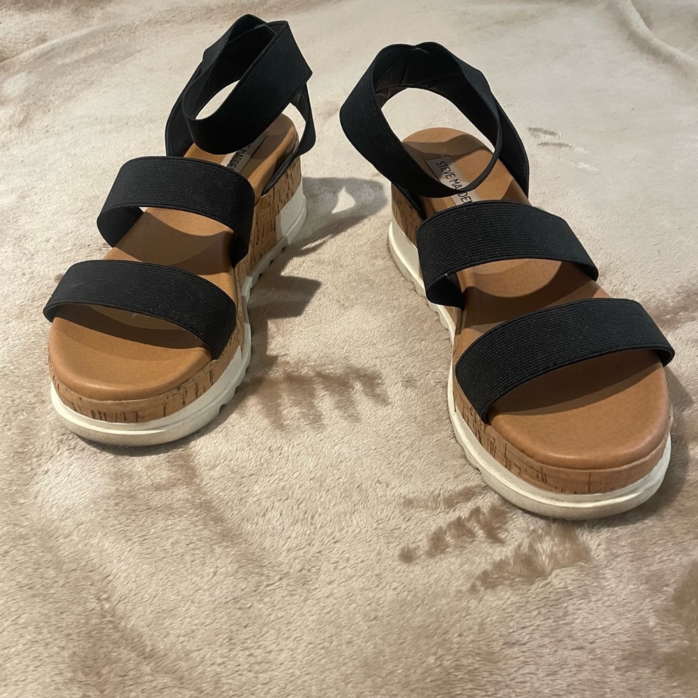 Cute Steve Madden wedge sandals. Black straps with cork wedge and white bottoms